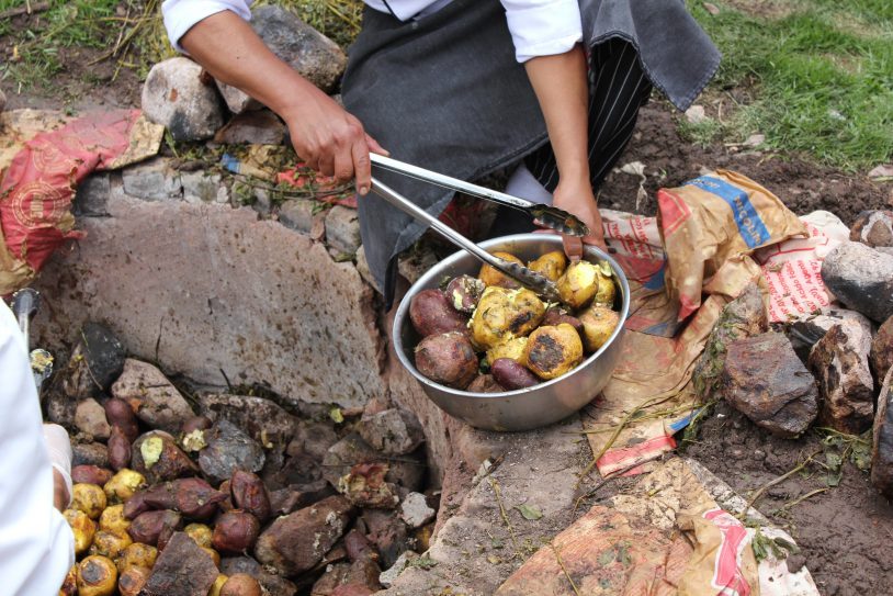 Steaming hot potatoes. A traditional Peruvian meal cooked in the earth by hot stones that create a natural underground oven.