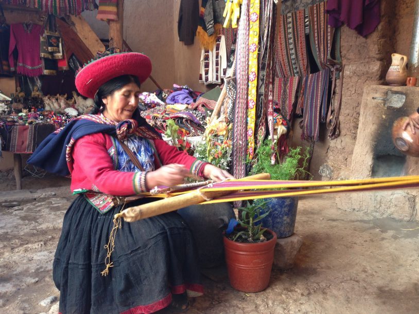 Peruvian craftswoman making colourful rope