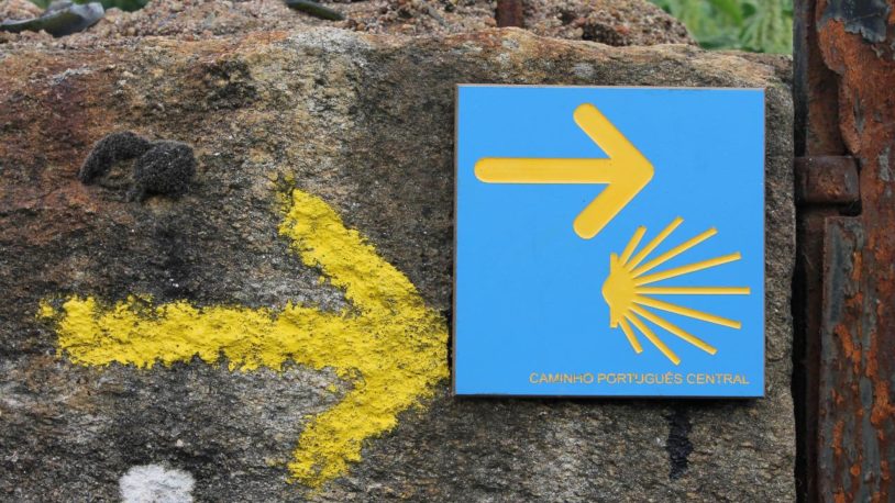 Camino hike signposts show female hikers the way to go