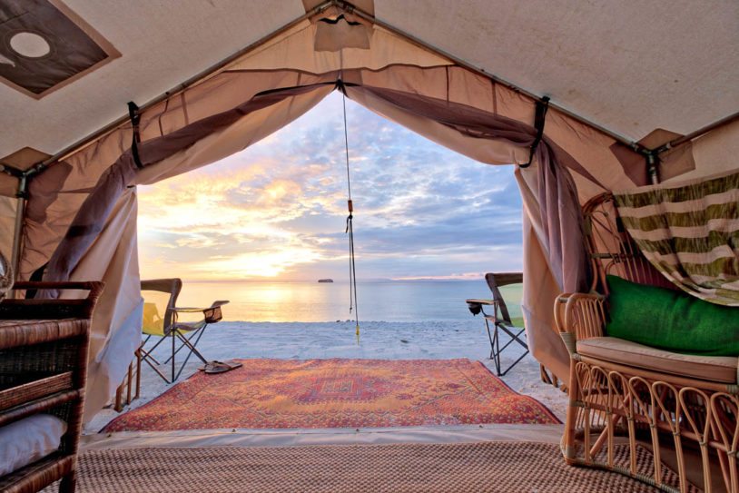 Beautiful sunset view from inside glamping tent right on the private beach