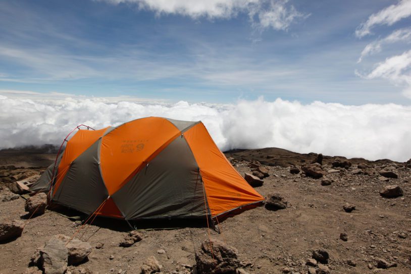 Orange tent set up and view is above the clouds
