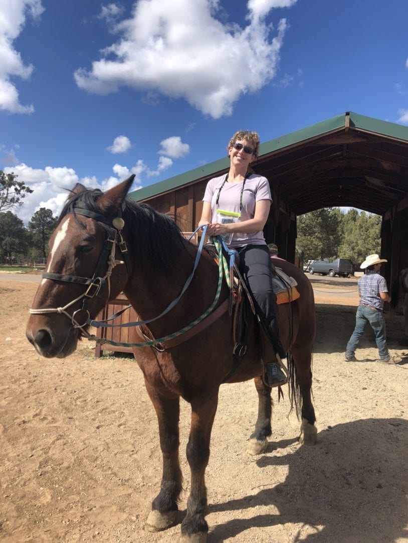 Woman on horseback in Zion women's adventure travel
