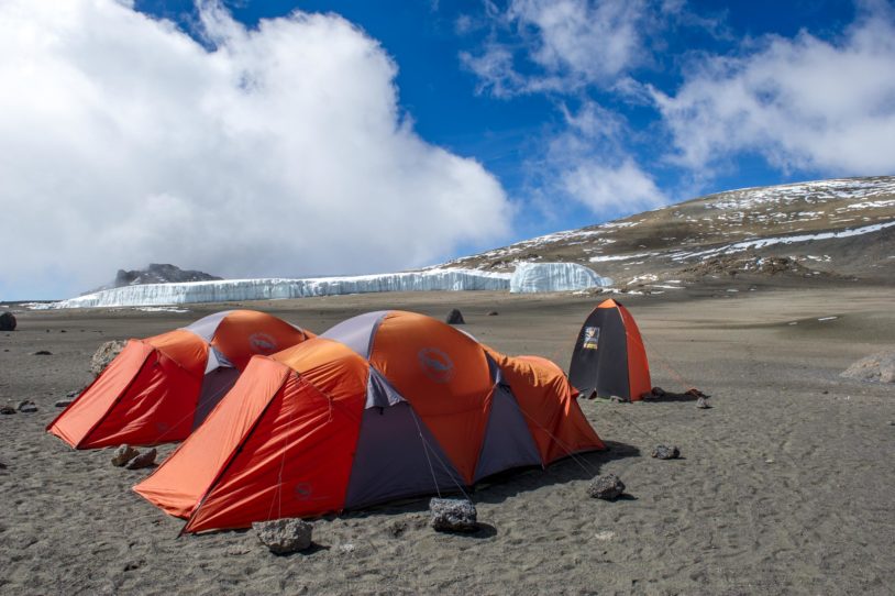 Orange pop up tents on Mt Kilimanjaro
