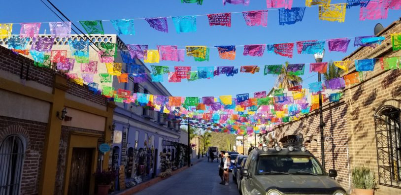 Colorful flags draped across the streets of Baja