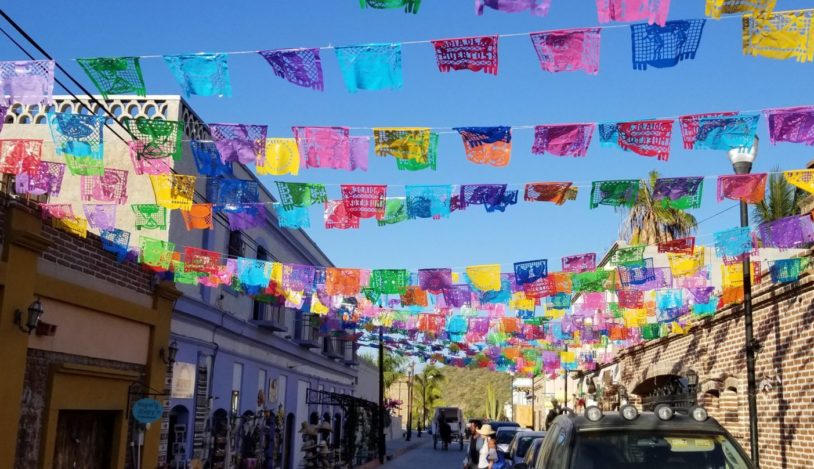 Colorful flags draped across the streets of Baja