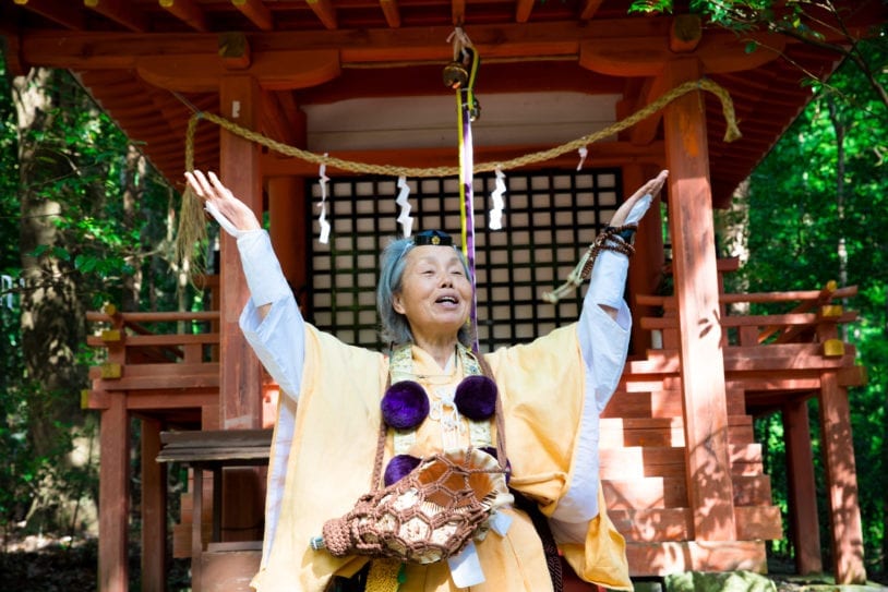 A traditional mountain priestess addresses the AdventureWomen group in Japan