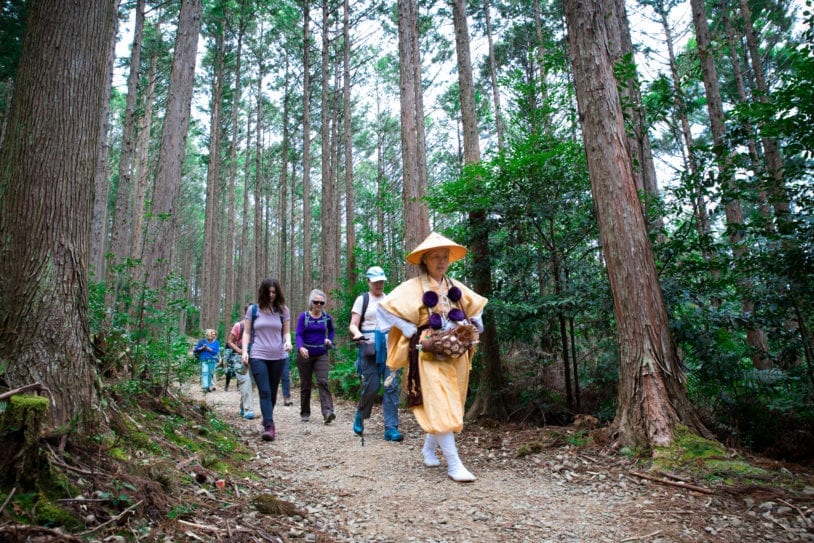 Traditional mountain ascetic priestess leads the way on the Kumano Kodo trail with AdventureWomen