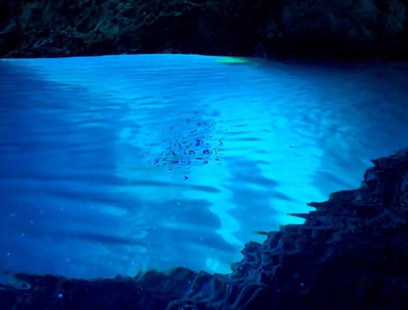 Blue waters lit up in cave