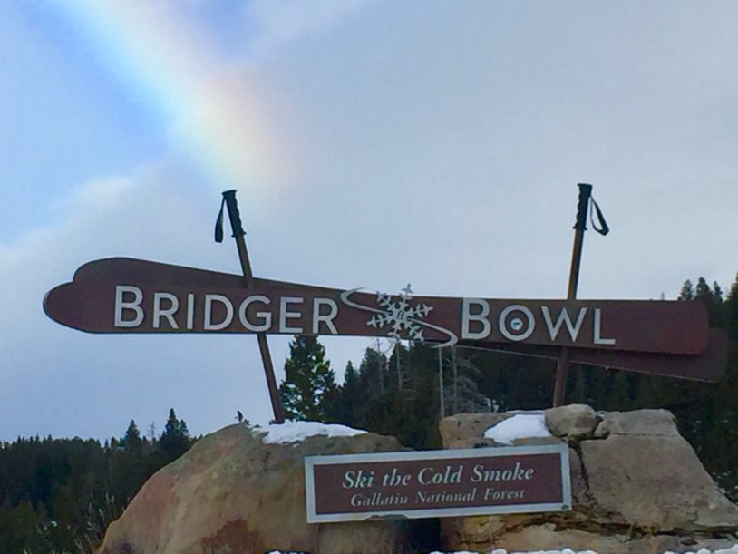 Bridger Bowl sign with rainbow behind it