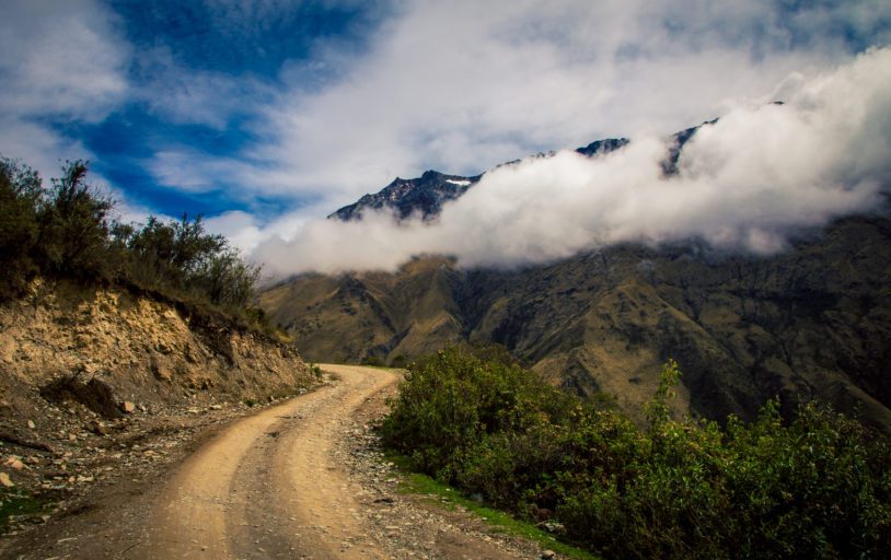 Winding dirt road in the Andes mountain in Peru