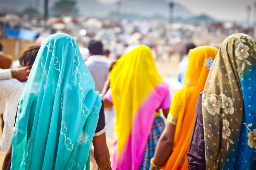 Indian Women dressed in colorful saris at Pushkar Camel Fair