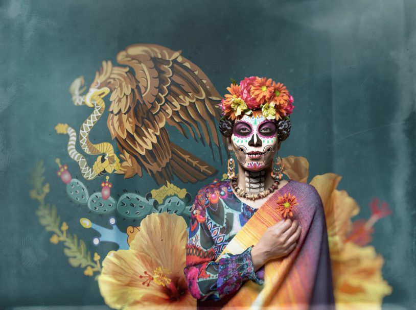 Dia de los Muertos woman with ceremonial make-up and mexican flag