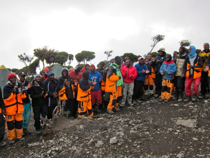 Porters singing along the route up hill