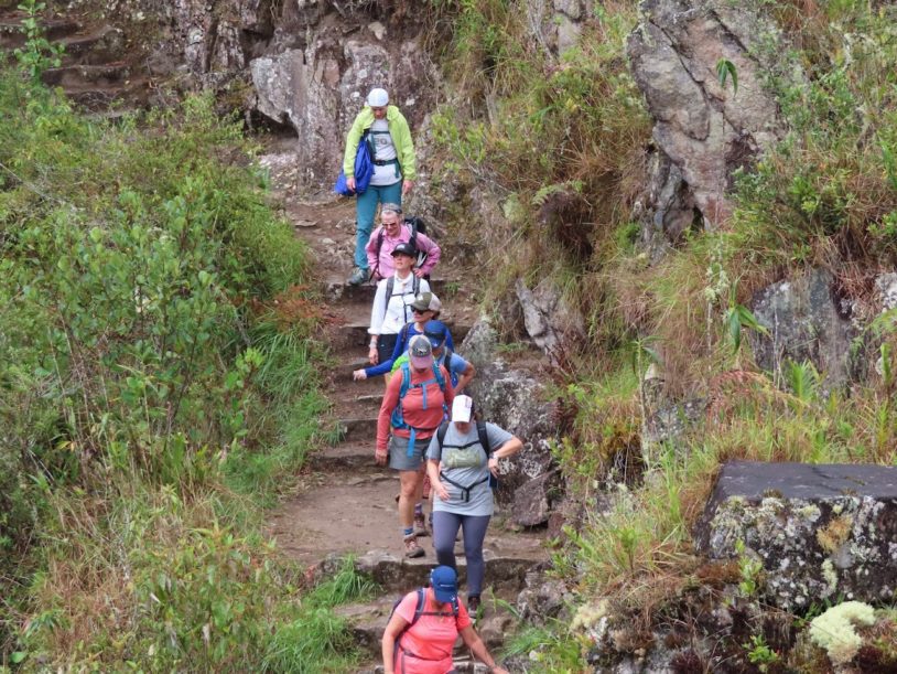 Group of women descending steps in Peru