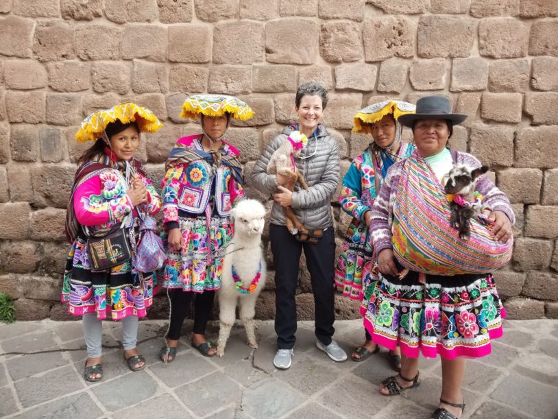 Women in colorful Peru clothing and hats