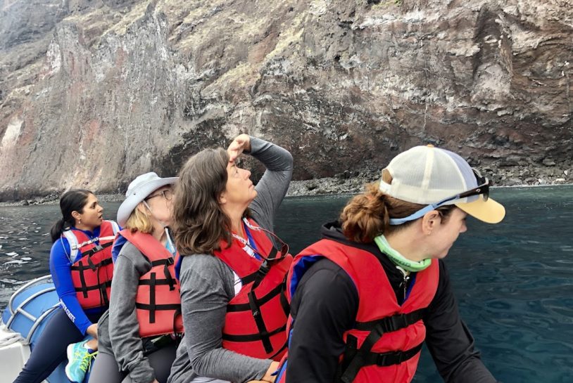Women on a raft learning about Galapagos history