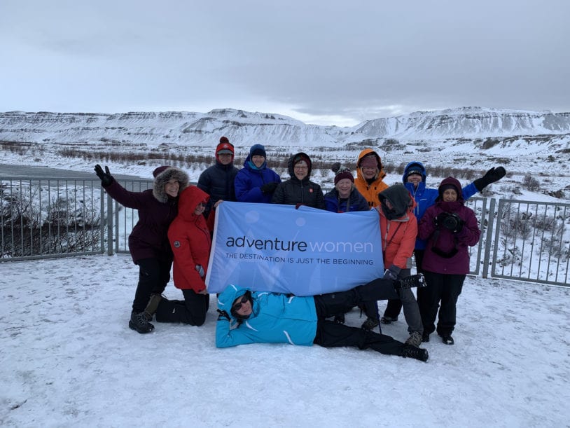 Group of women having fun posing for a photo from their trip with AdventureWomen in Iceland winter