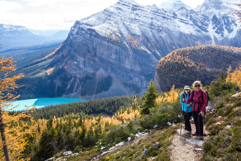 Two women high up on a trail above Banff Lake