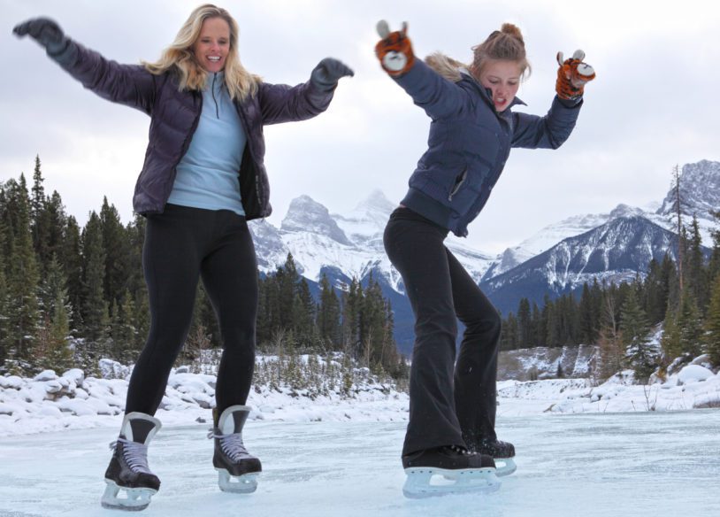 They are skating towards the camera and having fun, Canmore, Alberta