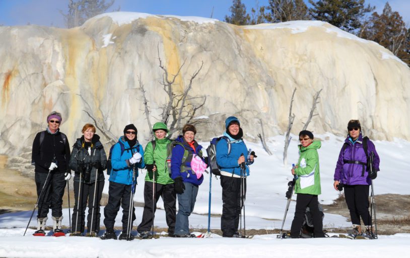 A group of women doing a snowshoeing activity