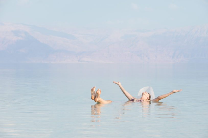 Woman floating in Dead Sea.
