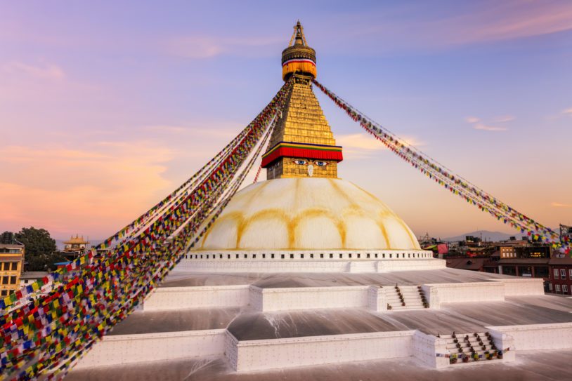 Sunset over Boudhanath (also called Bouddhanath, Bodhnath or Baudhanath or the Khasa Caitya) -this is one of the holiest Buddhist sites in Kathmandu, Nepal. It is known as Khasti by Newars as Bauddha or Bodh-nath by modern speakers of Nepali. Located about 11 km from the center and northeastern outskirts of Kathmandu, the stupa's massive mandala makes it one of the largest spherical stupas in Nepal. The Buddhist stupa of Boudhanath dominates the skyline. The ancient Stupa is one of the largest in the world.