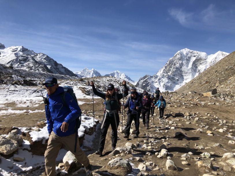 Line of women hikers starting across flatter land
